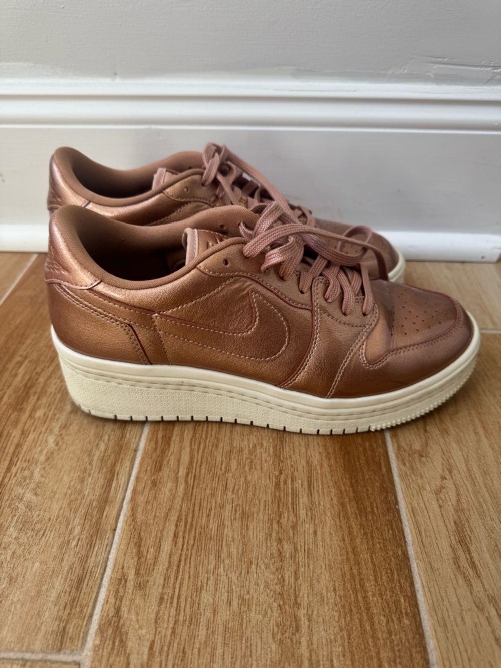 Nike Women's Air Jordan 1 Retro Low Lifted Sneakers in Metallic Red Bronze